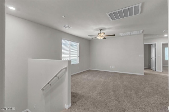 487 Via Renata, Henderson, NV 89044 - empty room featuring plenty of natural light, light colored carpet, a ceiling fan, and recessed lighting