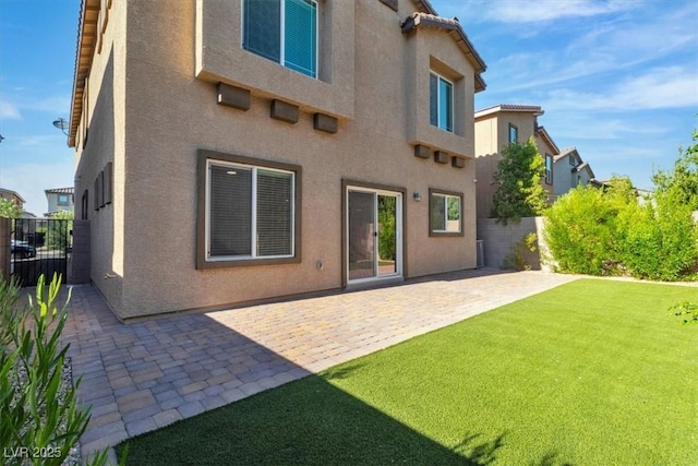 487 Via Renata, Henderson, NV 89044 - rear view of property with stucco siding and a patio area