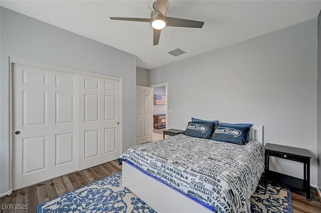7460 Chaffinch St, North Las Vegas, NV 89084 - bedroom featuring wood finished floors, a closet, and a ceiling fan