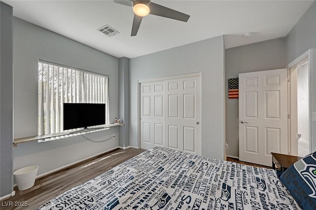 7460 Chaffinch St, North Las Vegas, NV 89084 - bedroom with wood finished floors, a closet, and a ceiling fan