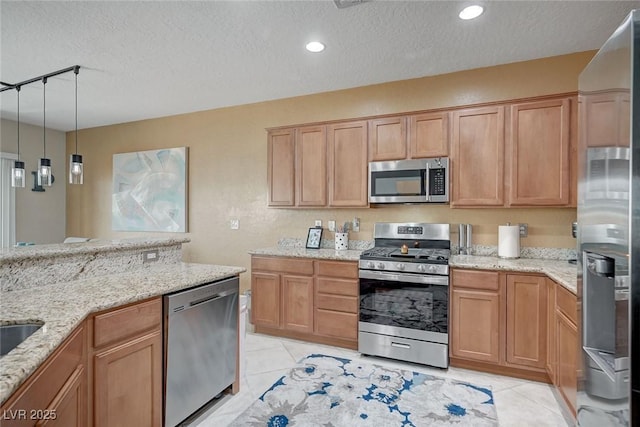 7460 Chaffinch St, North Las Vegas, NV 89084 - kitchen with stainless steel appliances, a textured ceiling, light stone countertops, light tile patterned flooring, and hanging light fixtures