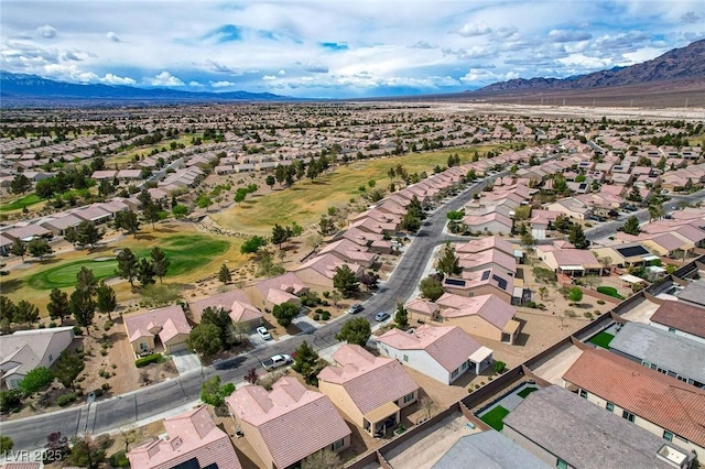 7460 Chaffinch St, North Las Vegas, NV 89084 - aerial perspective of suburban area featuring a mountain backdrop