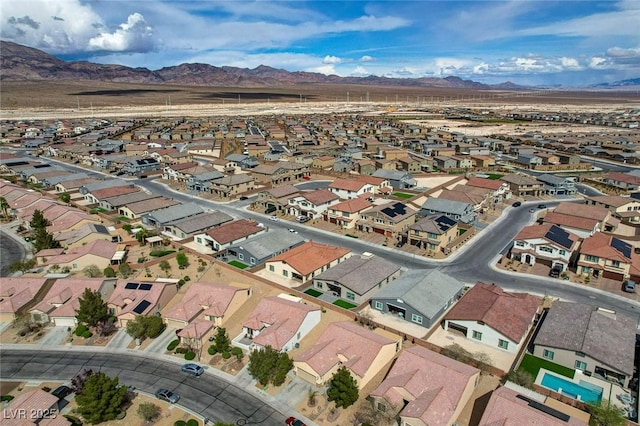7460 Chaffinch St, North Las Vegas, NV 89084 - aerial overview of property's location with mountains and nearby suburban area