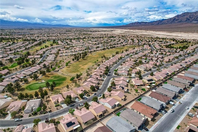 7460 Chaffinch St, North Las Vegas, NV 89084 - aerial overview of property's location with mountains and nearby suburban area