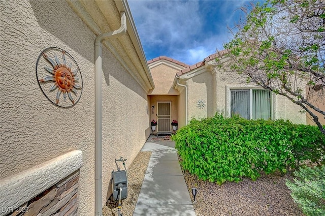 7460 Chaffinch St, North Las Vegas, NV 89084 - entrance to property with stucco siding