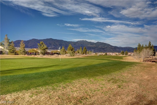 7460 Chaffinch St, North Las Vegas, NV 89084 - view of community featuring a mountain view, view of golf course, a lawn, and an area to practice putting