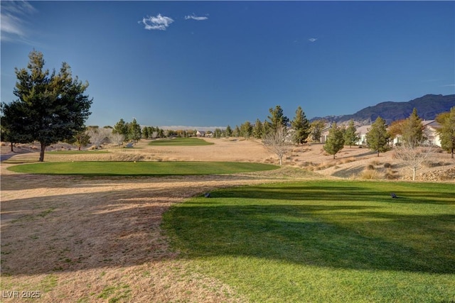 7460 Chaffinch St, North Las Vegas, NV 89084 - surrounding community featuring a mountain view, view of golf course, and a yard
