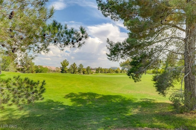 7460 Chaffinch St, North Las Vegas, NV 89084 - surrounding community with a lawn and golf course view