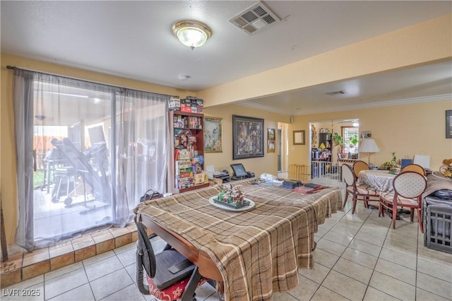 111 Narcissus Ln, Las Vegas, NV 89107 - dining area featuring light tile patterned floors and crown molding