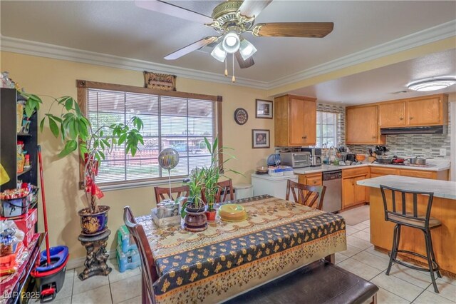 111 Narcissus Ln, Las Vegas, NV 89107 - dining room featuring light tile patterned flooring, ceiling fan, and ornamental molding