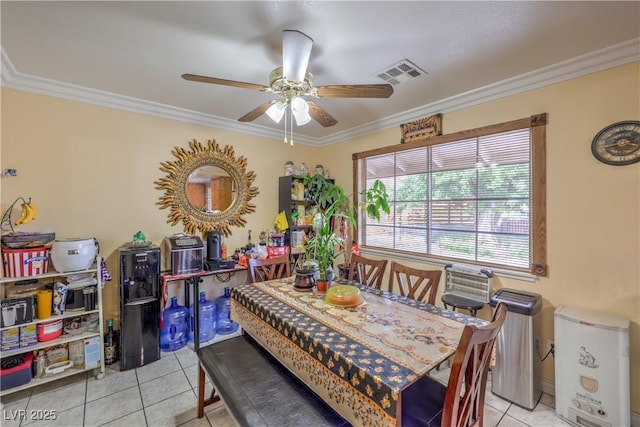 111 Narcissus Ln, Las Vegas, NV 89107 - dining space with a ceiling fan, light tile patterned floors, and crown molding