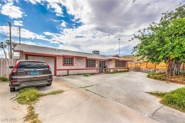 111 Narcissus Ln, Las Vegas, NV 89107 - ranch-style house featuring driveway, stucco siding, and an attached garage