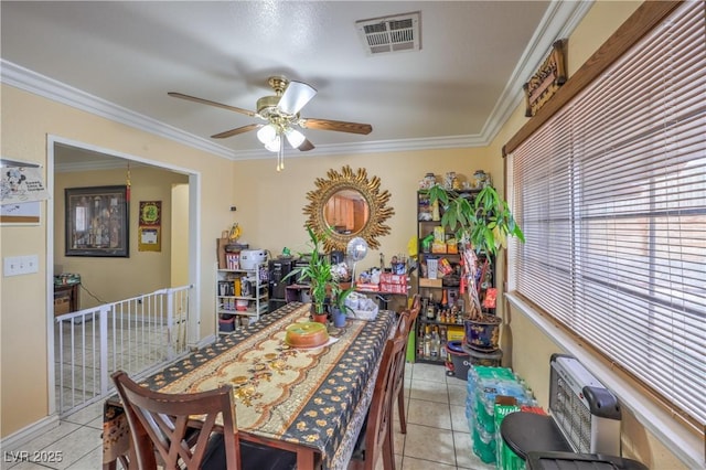 111 Narcissus Ln, Las Vegas, NV 89107 - dining area with light tile patterned floors, ceiling fan, and ornamental molding