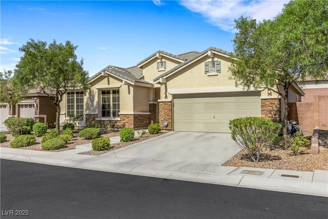 7125 Silver Ridge Peak St, Las Vegas, NV 89166 - view of front of home with stone siding, stucco siding, concrete driveway, and an attached garage