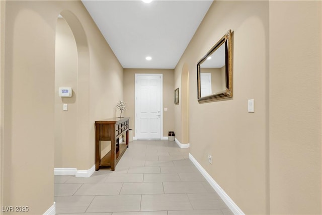 7125 Silver Ridge Peak St, Las Vegas, NV 89166 - hallway with light tile patterned floors, recessed lighting, and arched walkways