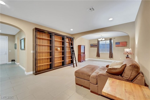 7125 Silver Ridge Peak St, Las Vegas, NV 89166 - sitting room featuring arched walkways, a chandelier, and recessed lighting