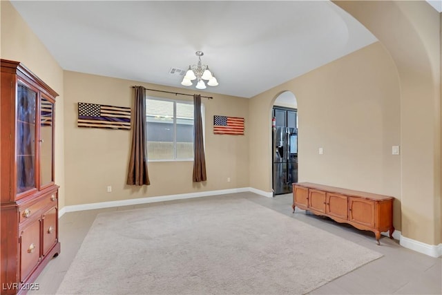 7125 Silver Ridge Peak St, Las Vegas, NV 89166 - empty room with arched walkways and a chandelier