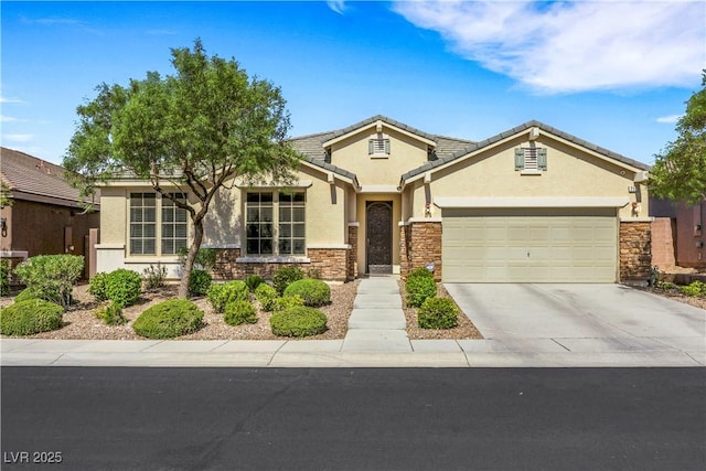 7125 Silver Ridge Peak St, Las Vegas, NV 89166 - view of front of property featuring stucco siding, an attached garage, concrete driveway, and stone siding