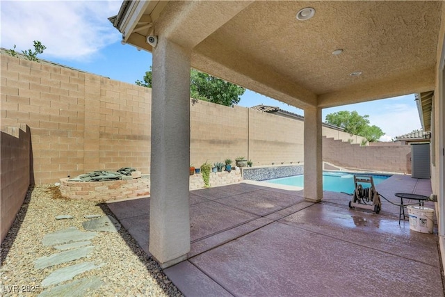 7125 Silver Ridge Peak St, Las Vegas, NV 89166 - fenced backyard with a patio