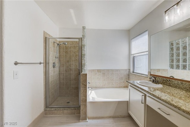 9409 Hershey Ln, Las Vegas, NV 89134 - full bathroom featuring vanity, a bath, and a stall shower