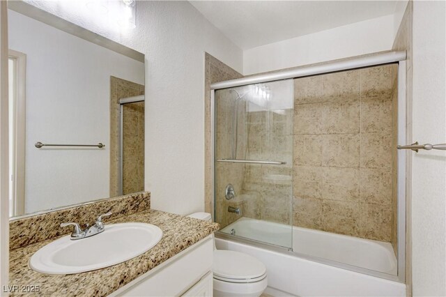 9409 Hershey Ln, Las Vegas, NV 89134 - bathroom featuring vanity and bath / shower combo with glass door