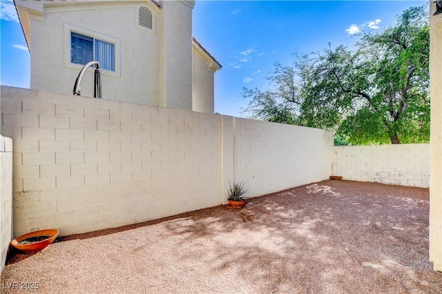 9409 Hershey Ln, Las Vegas, NV 89134 - fenced backyard with a patio area