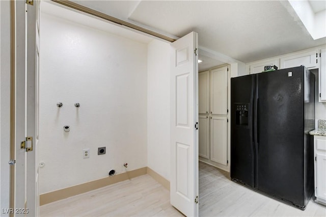 9409 Hershey Ln, Las Vegas, NV 89134 - laundry area with hookup for a gas dryer, light wood finished floors, and hookup for an electric dryer