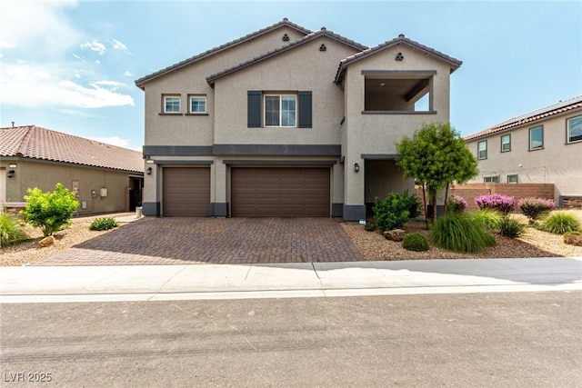 7615 Quail Dust St, North Las Vegas, NV 89084 - view of front of house with stucco siding, a garage, and driveway