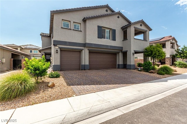 7615 Quail Dust St, North Las Vegas, NV 89084 - view of front of home featuring stucco siding, a garage, driveway, and a tile roof
