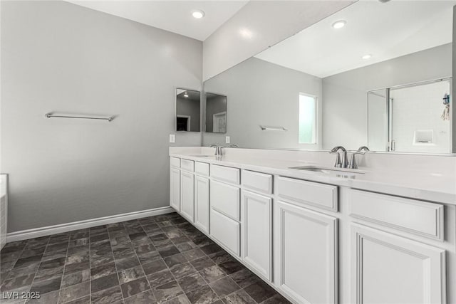 7615 Quail Dust St, North Las Vegas, NV 89084 - full bathroom featuring double vanity, stone finish flooring, and recessed lighting