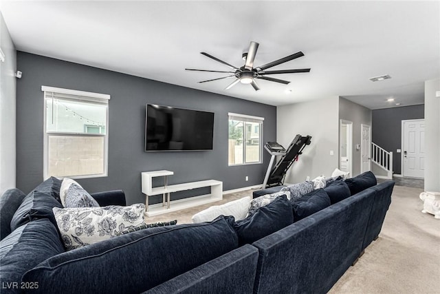 7615 Quail Dust St, North Las Vegas, NV 89084 - living area with a ceiling fan, light colored carpet, and stairs