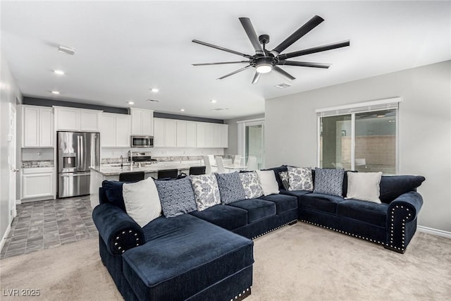 7615 Quail Dust St, North Las Vegas, NV 89084 - living room with ceiling fan, recessed lighting, and light colored carpet