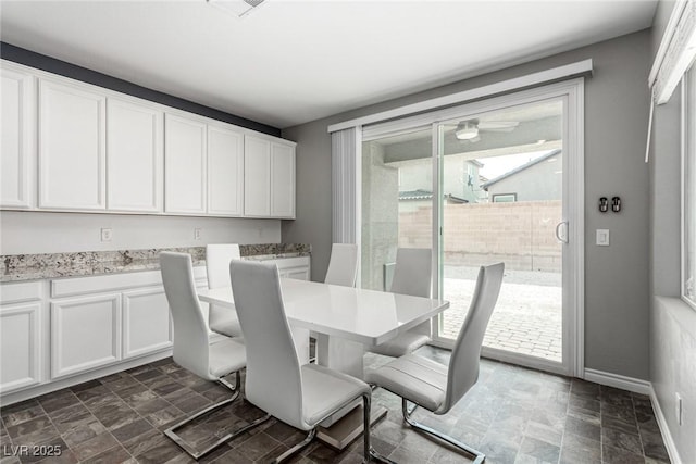 7615 Quail Dust St, North Las Vegas, NV 89084 - dining space featuring stone finish floors and a ceiling fan