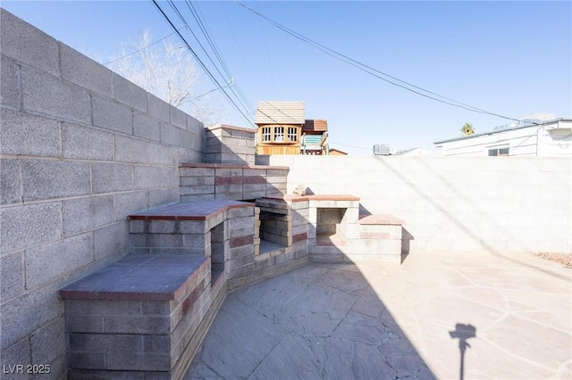 119 Cedar St, Henderson, NV 89015 - fenced backyard with a patio area