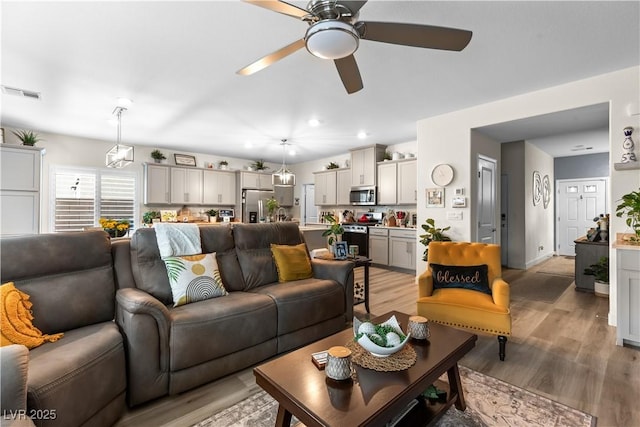1981 Komodo Dragon Ct, North Las Vegas, NV 89032 - living room with a ceiling fan and light wood finished floors