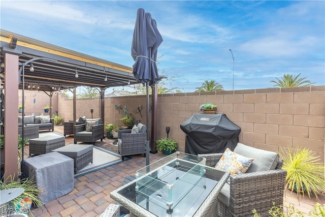 1981 Komodo Dragon Ct, North Las Vegas, NV 89032 - fenced backyard featuring outdoor lounge area, a patio, and a grill