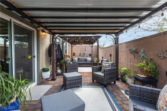 1981 Komodo Dragon Ct, North Las Vegas, NV 89032 - fenced backyard featuring outdoor lounge area and a patio