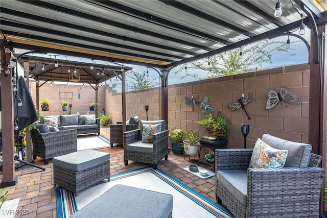 1981 Komodo Dragon Ct, North Las Vegas, NV 89032 - fenced backyard with outdoor lounge area, a gazebo, and a patio area