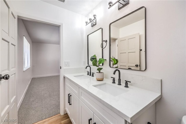4616 Eureka St, Las Vegas, NV 89103 - bathroom featuring double vanity and baseboards