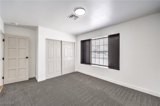 4616 Eureka St, Las Vegas, NV 89103 - unfurnished bedroom with dark colored carpet and a closet