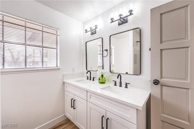 4616 Eureka St, Las Vegas, NV 89103 - bathroom featuring double vanity and baseboards