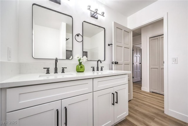 4616 Eureka St, Las Vegas, NV 89103 - bathroom featuring double vanity and wood finished floors
