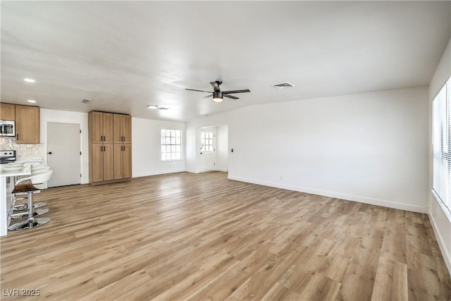 4616 Eureka St, Las Vegas, NV 89103 - unfurnished living room with ceiling fan and light wood finished floors