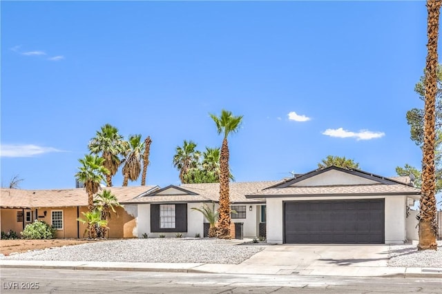4616 Eureka St, Las Vegas, NV 89103 - ranch-style house with a garage, driveway, stucco siding, and solar panels