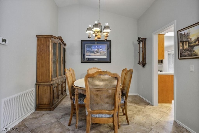 9325 Yucca Blossom Dr, Las Vegas, NV 89134 - dining room with a chandelier, vaulted ceiling, and light tile patterned floors