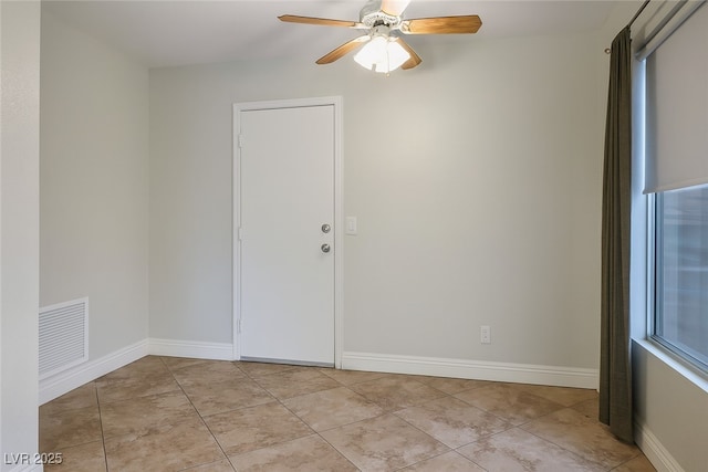 9325 Yucca Blossom Dr, Las Vegas, NV 89134 - empty room with ceiling fan and light tile patterned flooring