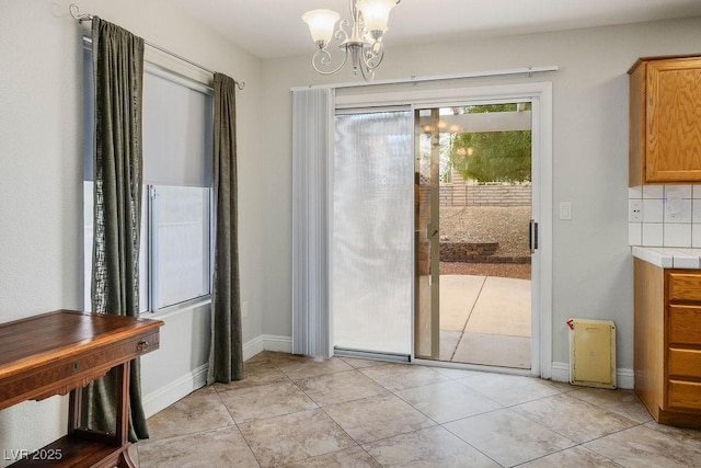 9325 Yucca Blossom Dr, Las Vegas, NV 89134 - unfurnished dining area with a chandelier and light tile patterned flooring