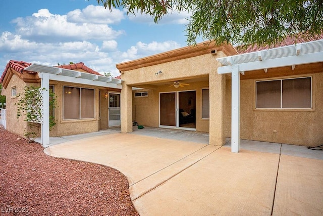 9325 Yucca Blossom Dr, Las Vegas, NV 89134 - rear view of house featuring stucco siding, a pergola, and a ceiling fan