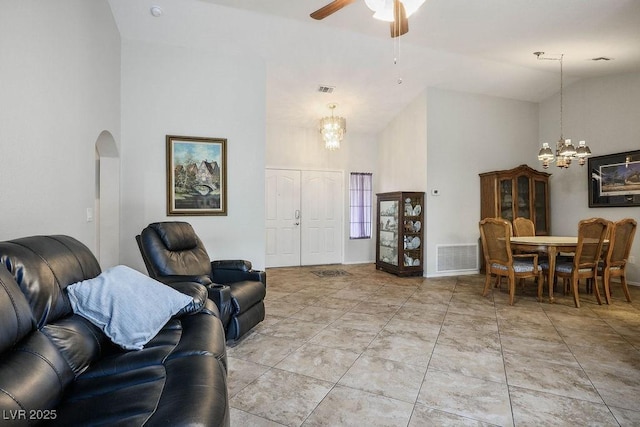 9325 Yucca Blossom Dr, Las Vegas, NV 89134 - living area featuring a chandelier, high vaulted ceiling, arched walkways, and ceiling fan