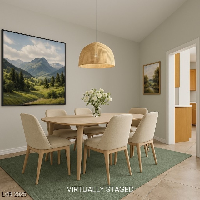 9325 Yucca Blossom Dr, Las Vegas, NV 89134 - dining space featuring a mountain view, light tile patterned flooring, and lofted ceiling